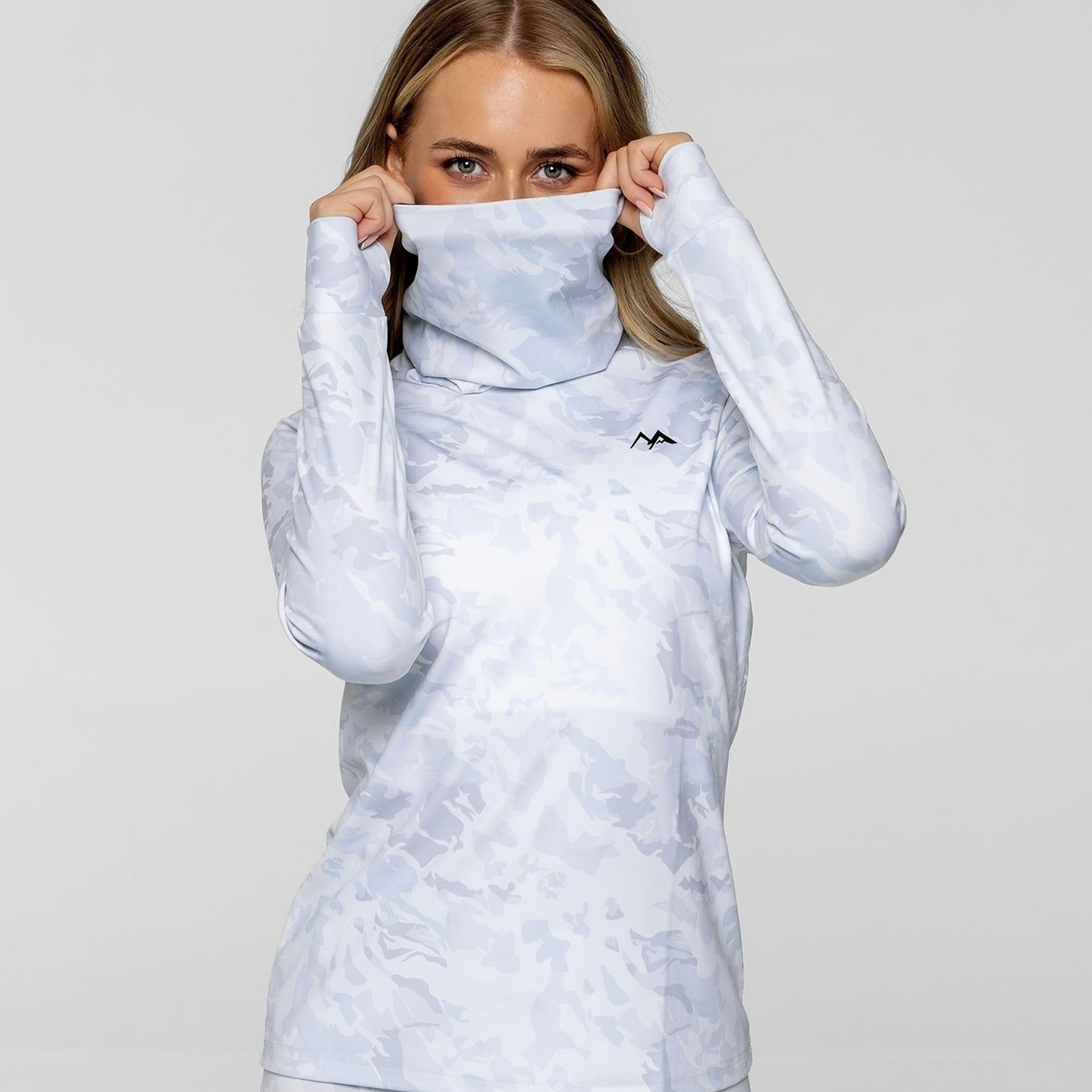 Model wearing Arctic Eco-Sno Women's Thermal Base Layer Top in Sno-Camo.