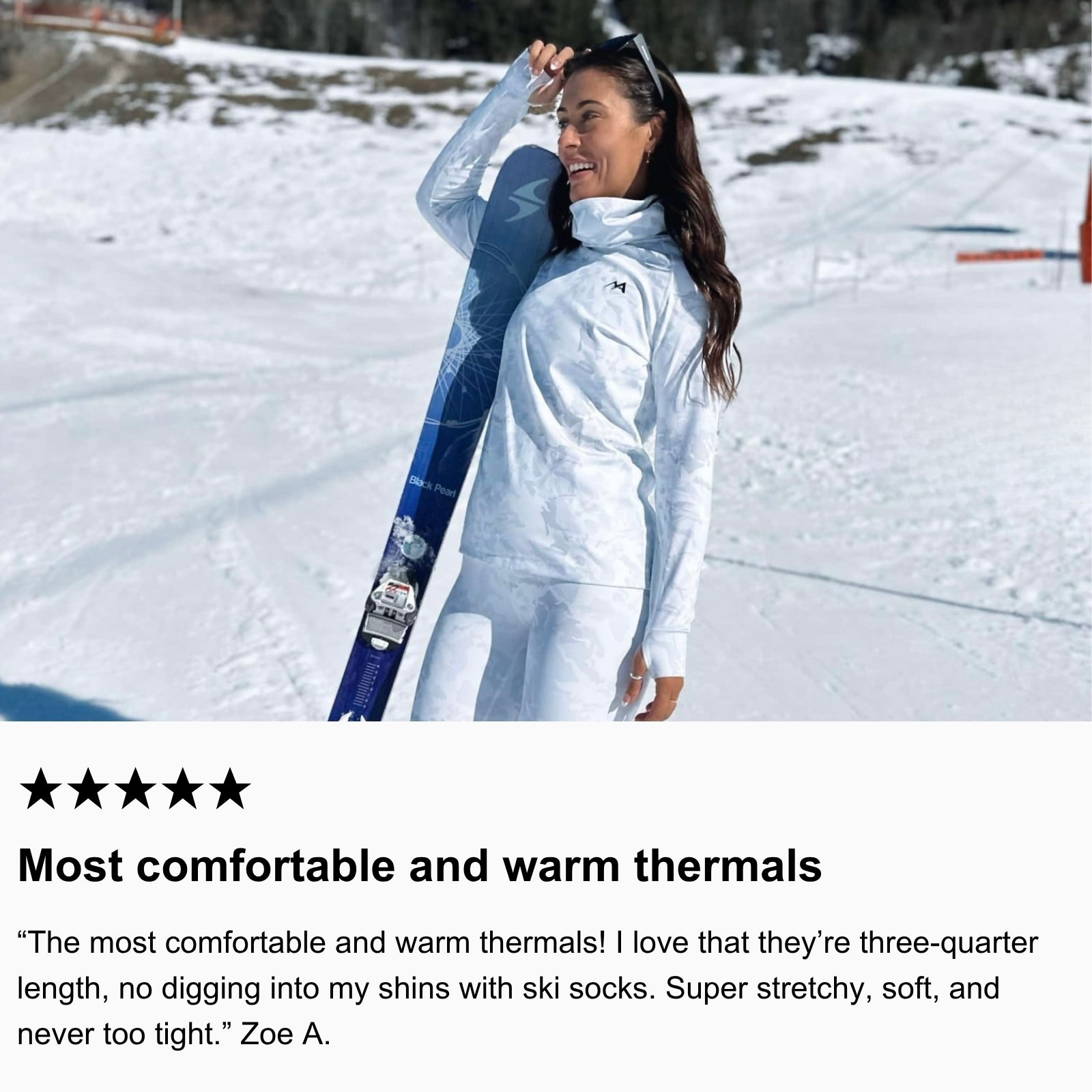 Photo of community member standing in the snow holding her skis wearing Arctic Eco-Sno Women's Base Layer Top and Base Layer Leggings in Sno-Camo.