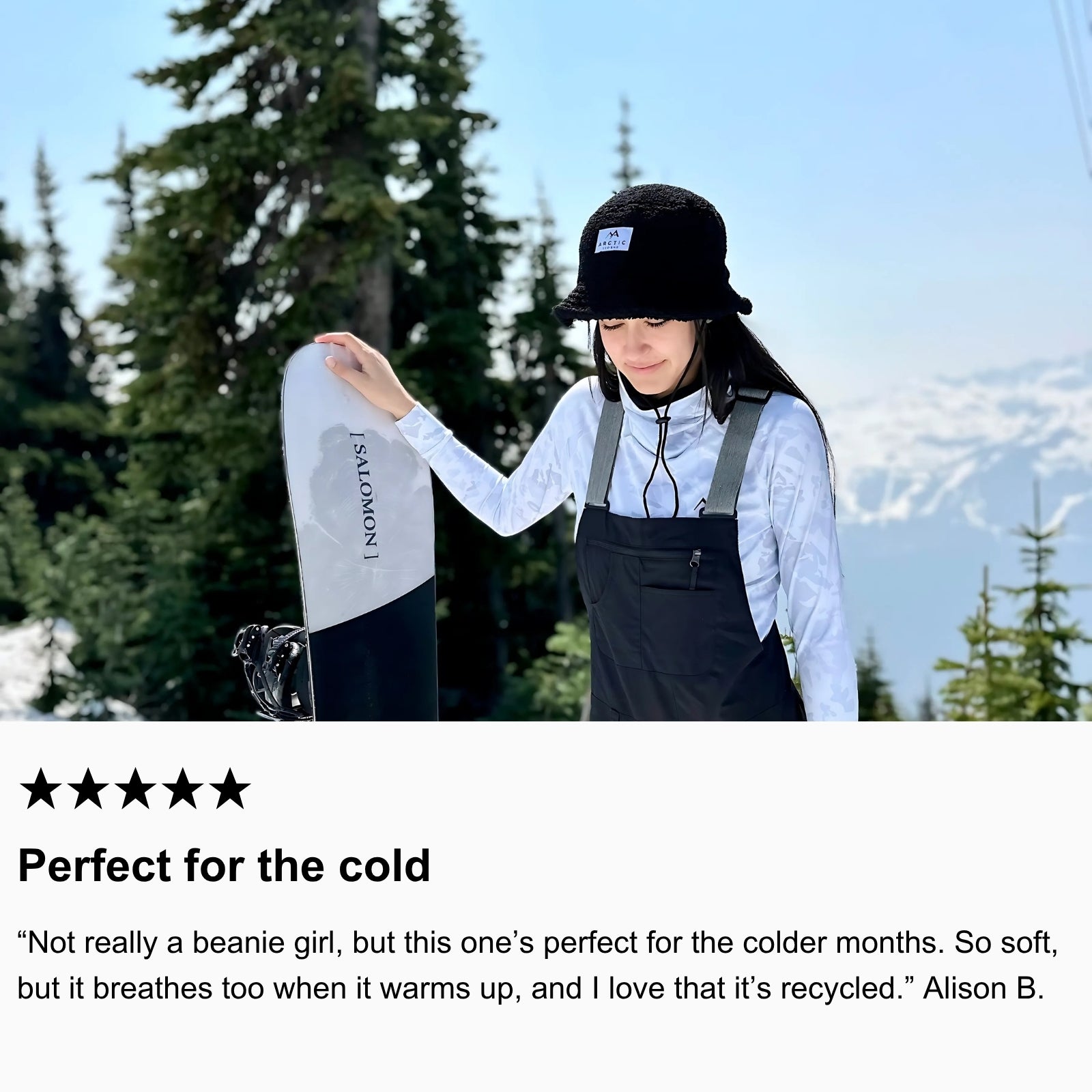 Photo of community member snowboarding, wearing Arctic Eco-Sno’s Bucket Hat and Women’s Base Layers in Sno-Camo.