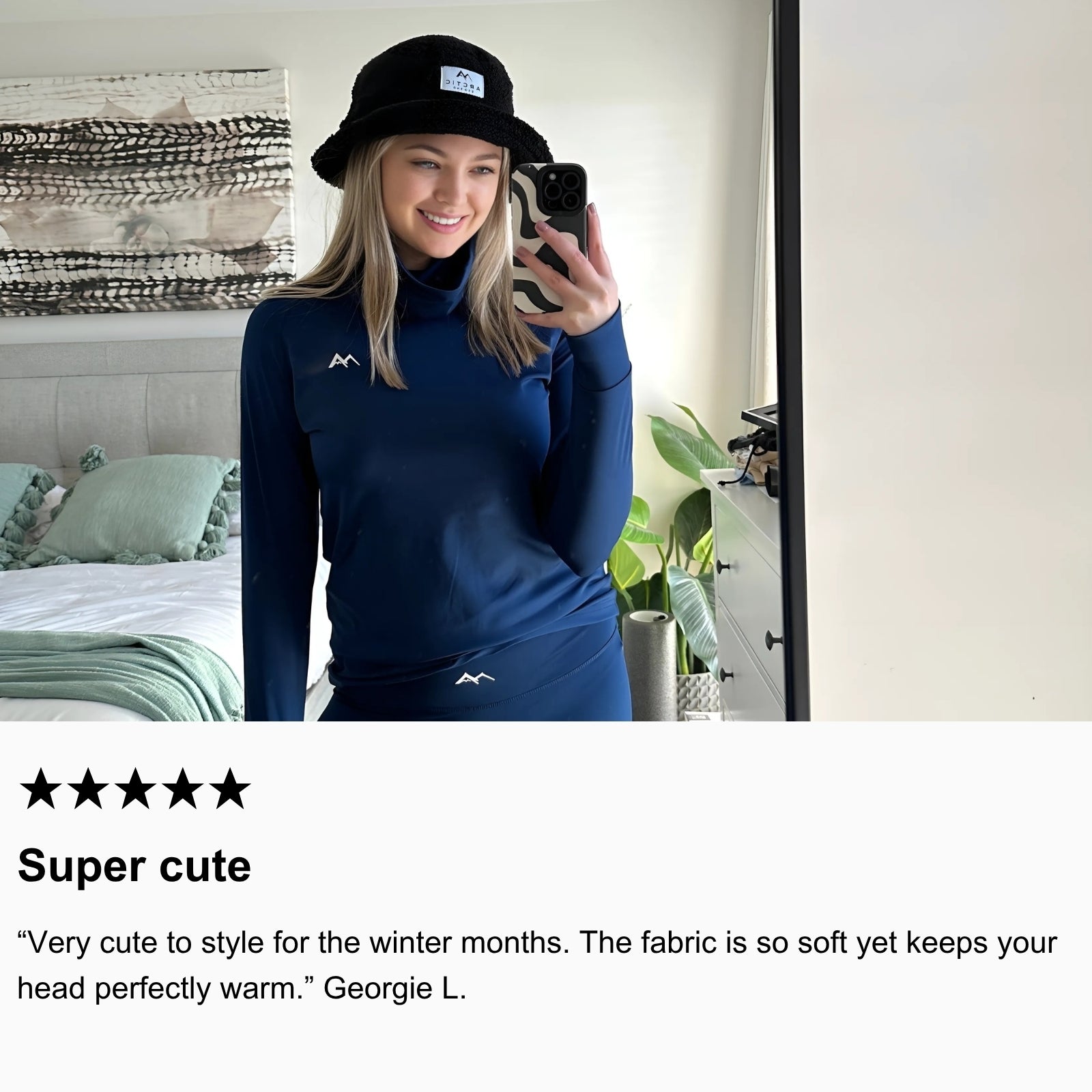 Photo of community member taking a photo, wearing Arctic Eco-Sno’s Bucket Hat and Women’s Base Layers in Night Sky Navy.