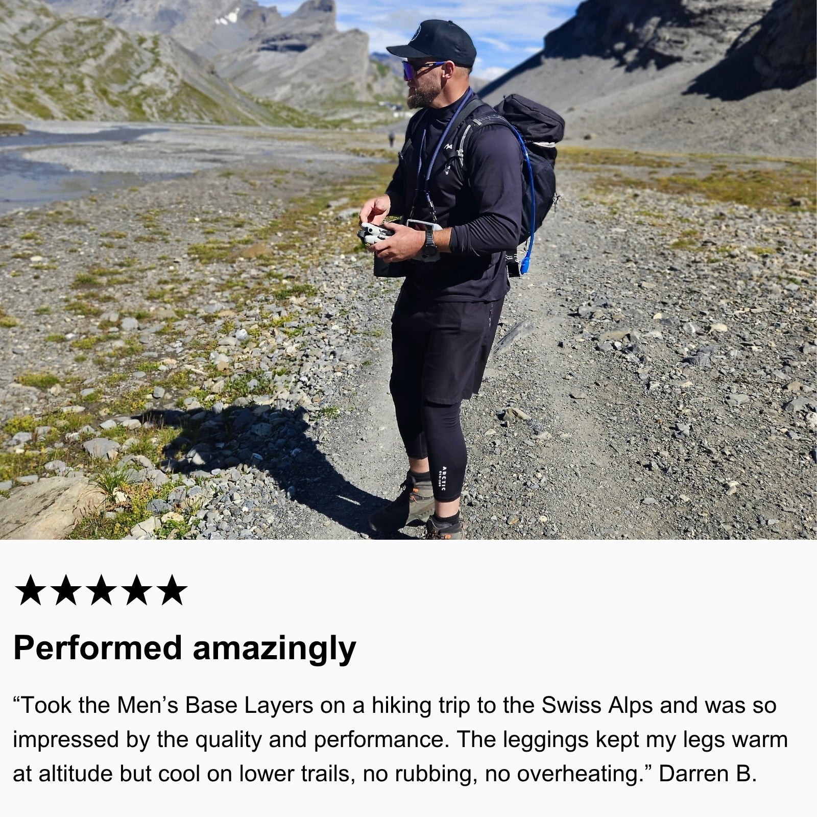 Photo of community member hiking in the Swiss Alps wearing Arctic Eco-Sno Men’s Base Layer Top and Base Layer Pants in Black.