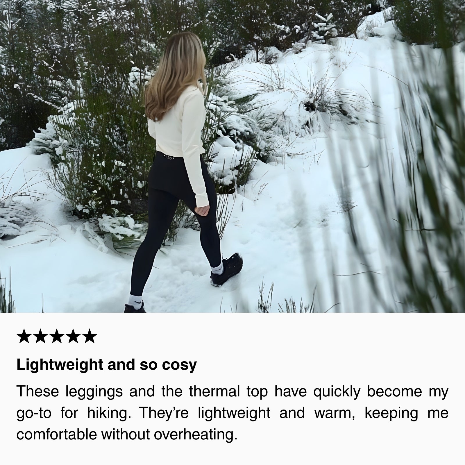 Woman hiking in snowy terrain wearing black hiking leggings with pockets and a lightweight thermal top, demonstrating warmth, mobility, and secure waistband during winter hikes.
