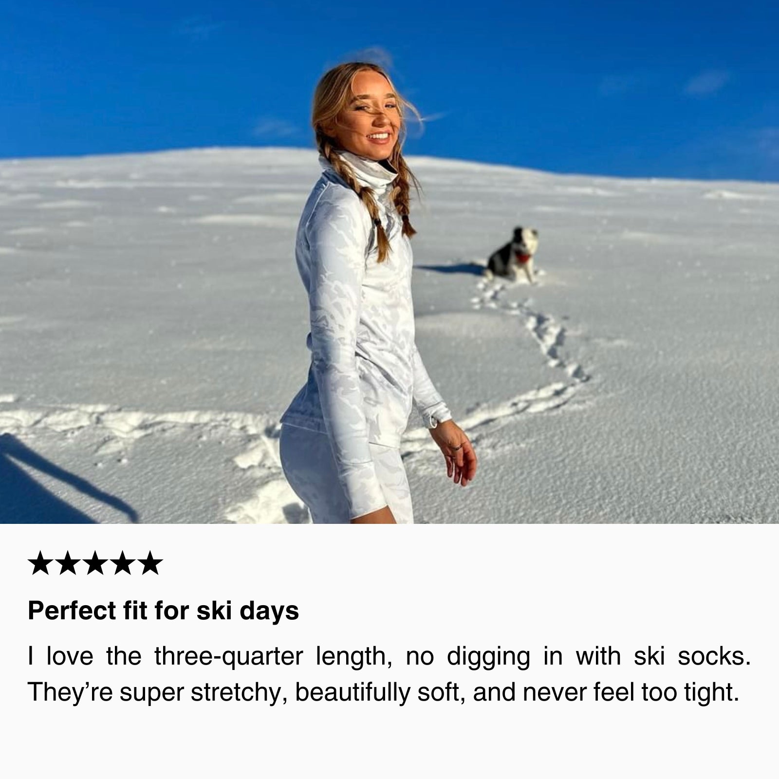 Woman wearing light-colored thermal base layer leggings standing on a snowy mountain landscape, smiling in winter conditions.