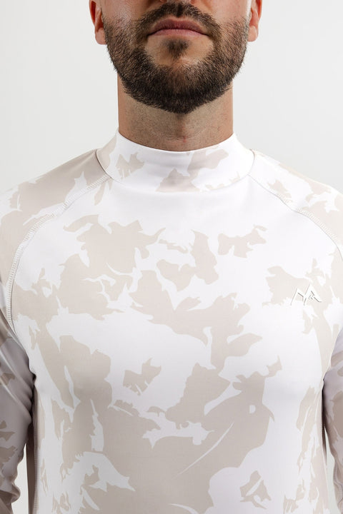 Close-up of men's Alpine Grey thermal ski top showing the mock neck collar, raglan seams, white mountain logo and grey camouflage print.