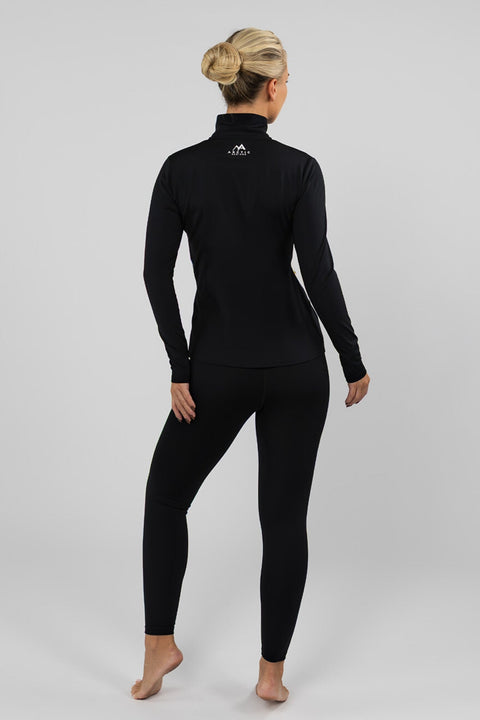 Full-length rear view of the Arctic Eco-Sno women's black quarter zip thermal top with matching leggings, showing the back fit.