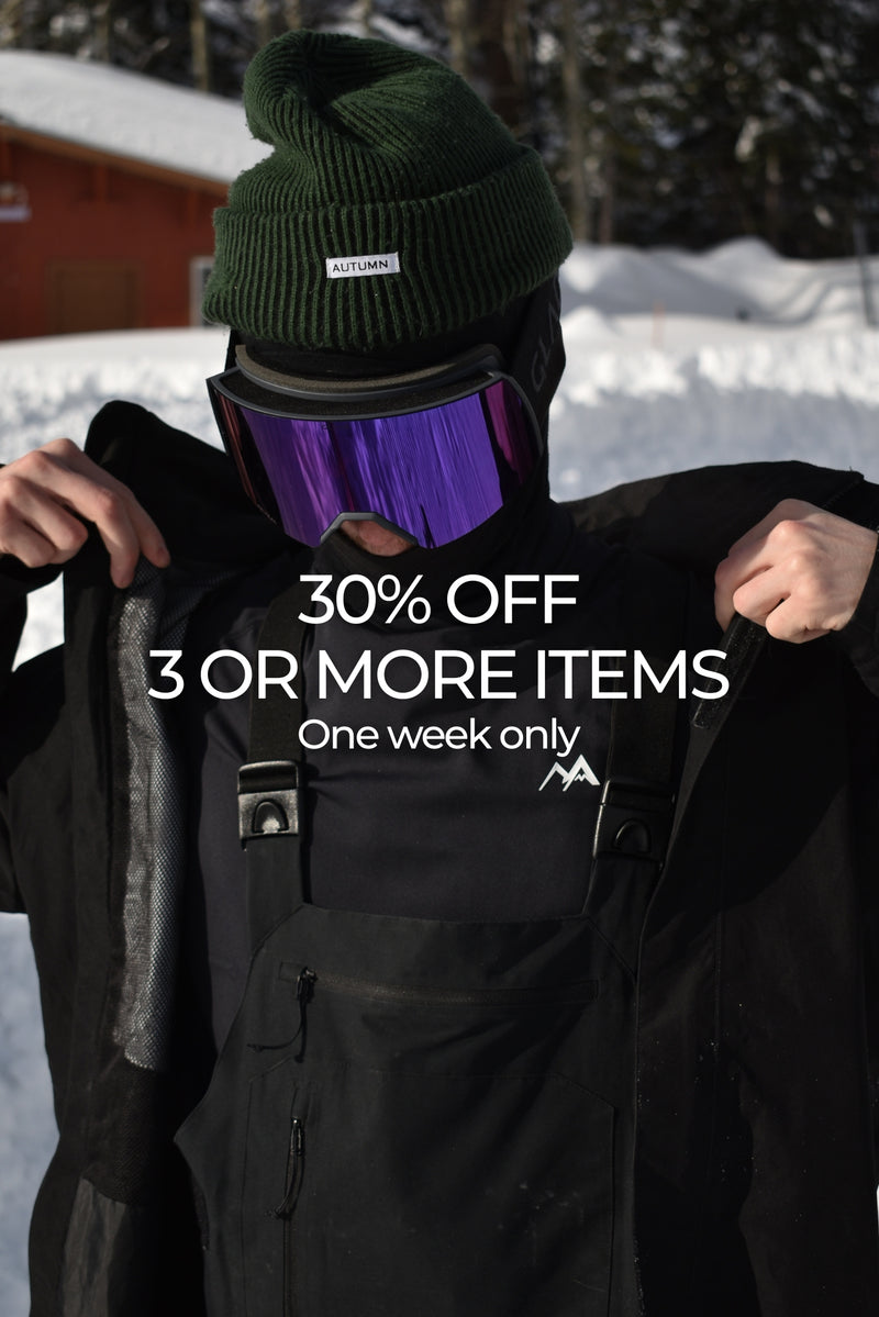 Man wearing blackbase layer in snowy landscape with text on screen advertising 30% off sale