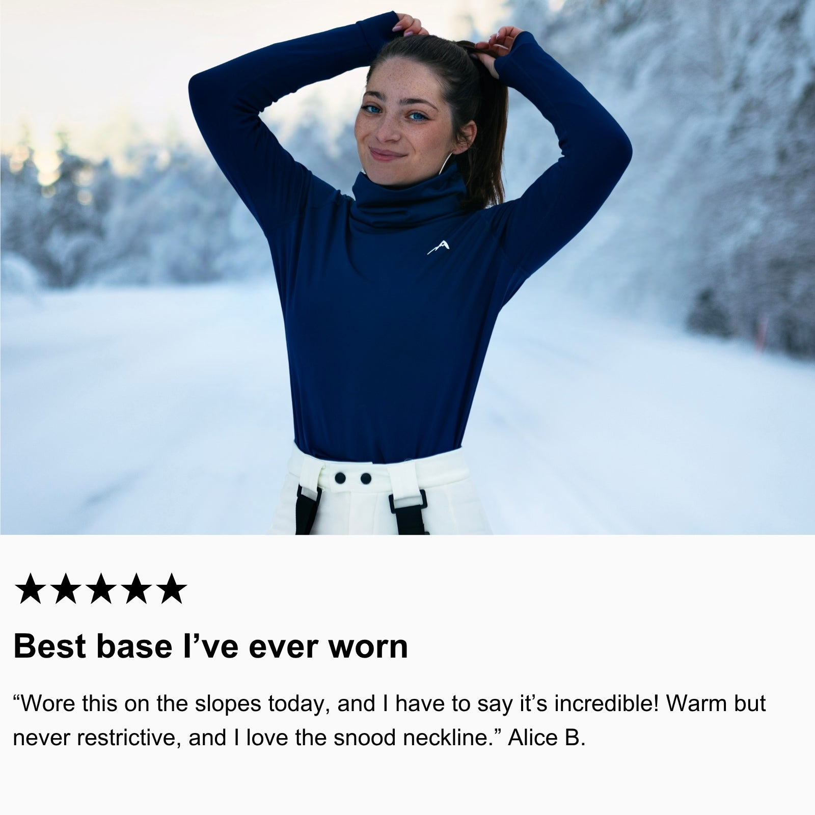 Photo of community member standing in snow, wearing Arctic Eco-Sno Women’s Base Layer Top in Night Sky Navy.