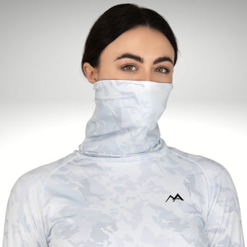 Woman showing face and neck warmer feature in snow-camo women's base layers.