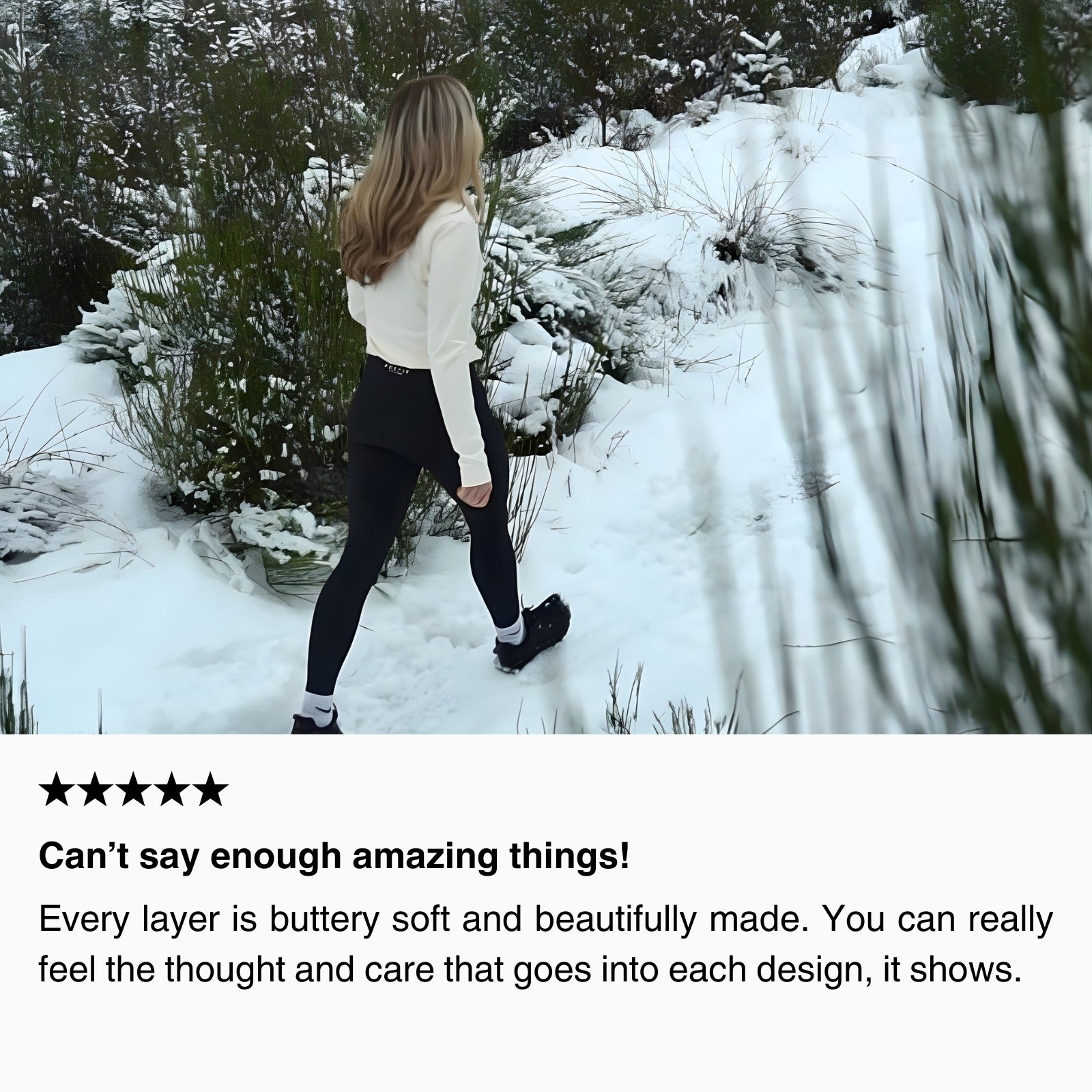 Woman hiking uphill in snowy woodland wearing women’s thermal hiking leggings and a long-sleeve base layer top, demonstrating lightweight warmth and comfort for cold-weather hiking.